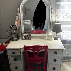 Makeup vanity with mirror.